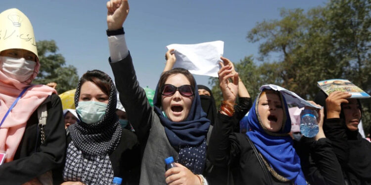 Afghan women protest school attack as Taliban cracks down