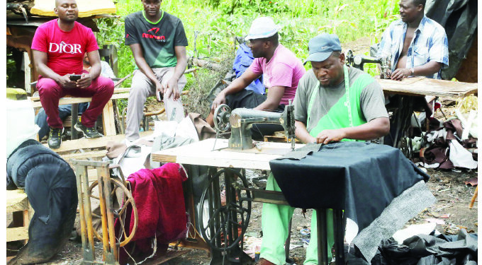 Like a phoenix…Outspan traders back at work after inferno