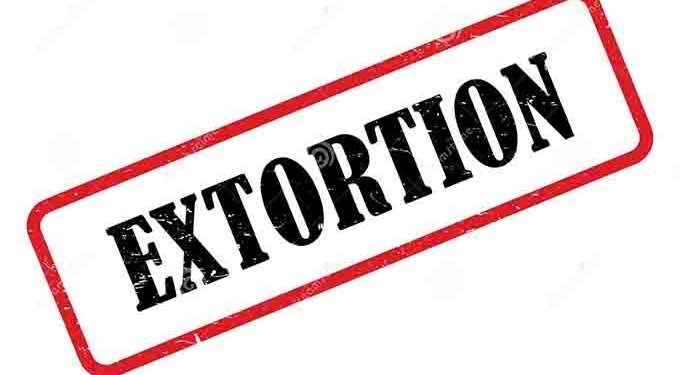 Four detectives in court on charges of extortion